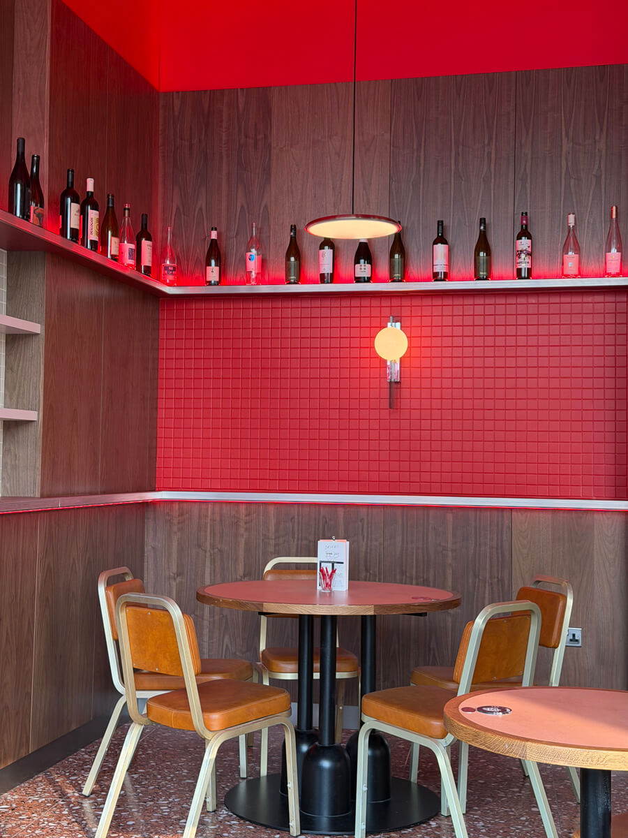 A selection of wine above some seats